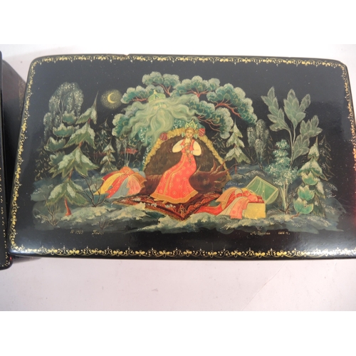 143 - 20th Century Russian lacquer box, the hinged cover painted with a mythological scene, 20cm wide, tog... 