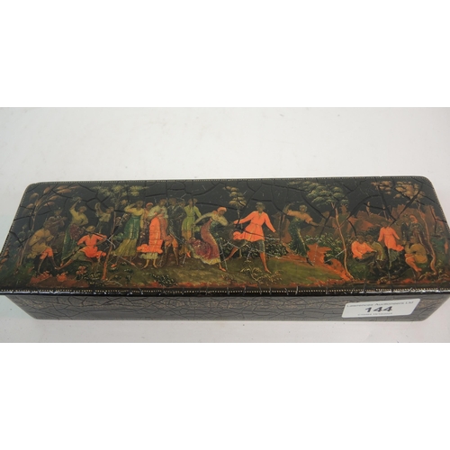 144 - Russian papier mache box, the rectangular hinged cover decorated with a group of figures in a landsc... 