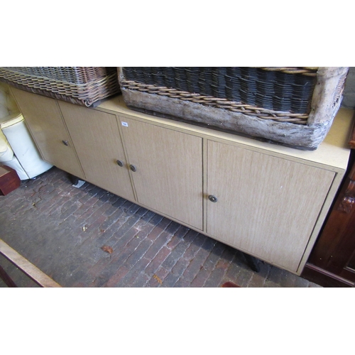 1644 - 20th Century light oak laminated sideboard of four drawers, raised on ebonised feet, 200cm wide