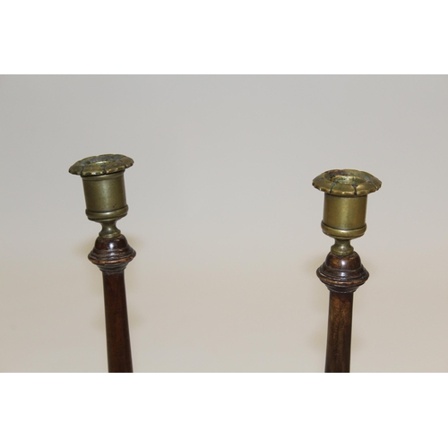 1670 - Pair of late 19th Century mahogany and brass mounted candlesticks in George III style, 46cm high