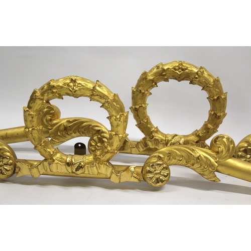 1685 - Pair of 19th Century gilded composition pelmets of laurel wreath and scroll design, 178cm wide