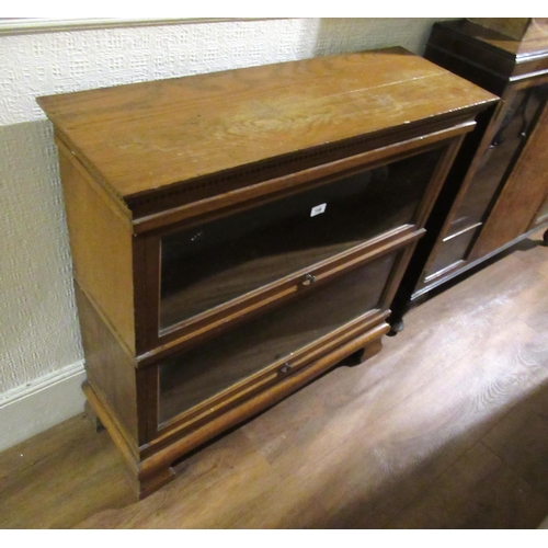 1689 - Two section oak bookcase on ogee bracket feet by Chapter, 91cm wide