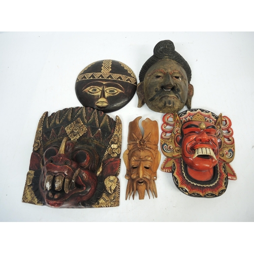 188 - Group of six various native wooden wall masks