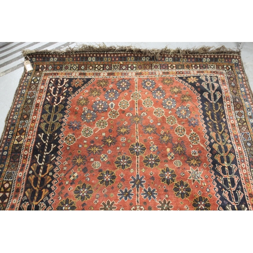 2 - Qashqai rug with a medallion and all-over stylised design on a red ground with borders, 200 x 125cm