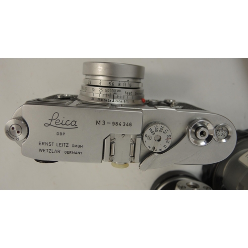 267 - Leica M3 camera outfit, serial number 984346 with original leather case, together with three lenses,... 