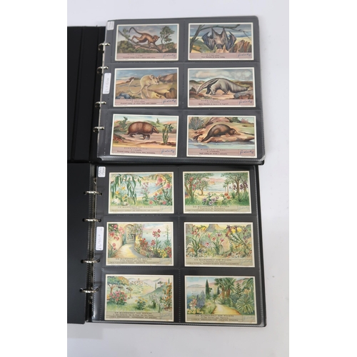 287 - Five albums of Liebig trading cards containing various complete sets