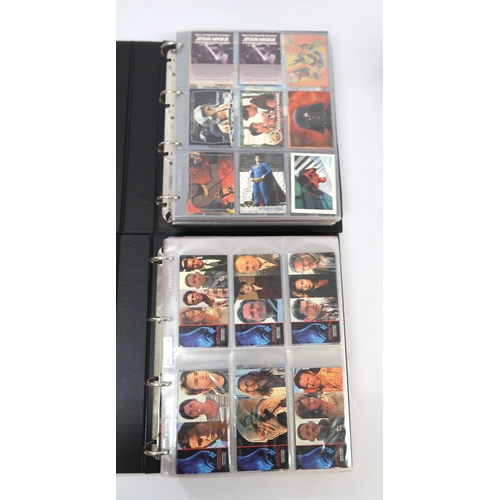 299 - Five albums of Topps trading cards, including Twighlight, Flintstones, Last Action Hero etc.