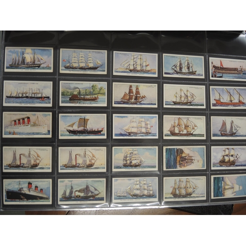 312 - One album of Churchman cigarette cards, including Lawn Tennis, World Wonders etc.