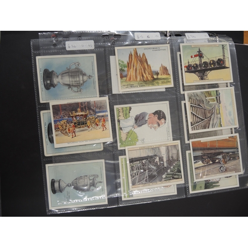 312 - One album of Churchman cigarette cards, including Lawn Tennis, World Wonders etc.