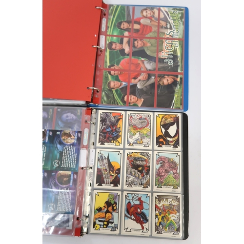 320 - Five albums of trading cards, including Sandman, Justice League, 24, Lost in Space etc.