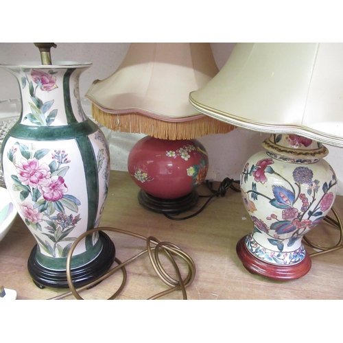 562 - Four various pottery table lamps with shades