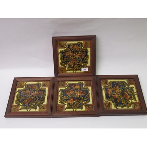 572 - W.B. Simpson & Sons, set of four framed pottery tiles decorated with a stylised floral design, each ... 