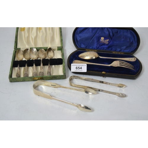 654 - Cased silver Christening pair, two pairs of sugar tongs and five silver coffee spoons, 5.5oz t