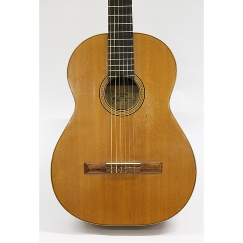 69 - A.A. Jones of Norwich, a classical guitar with original label, signed and dated 1963, with an associ... 