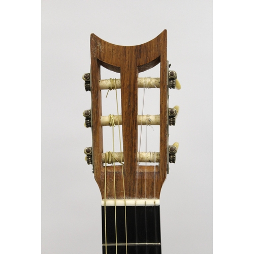 69 - A.A. Jones of Norwich, a classical guitar with original label, signed and dated 1963, with an associ... 