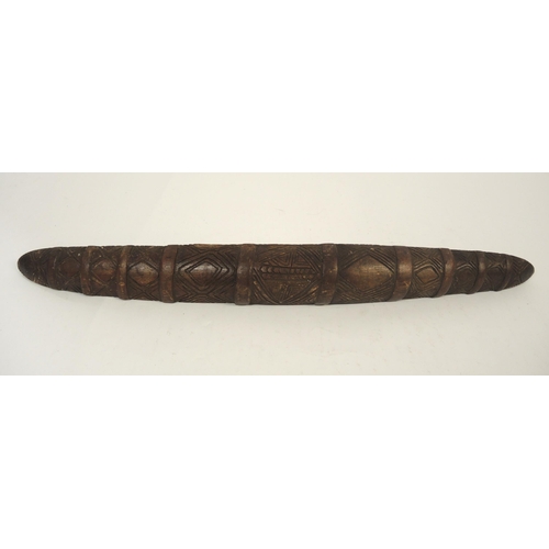 79 - Late 19th / early 20th Century Aboriginal parrying shield with typical carved decoration, 77.5cm lon... 