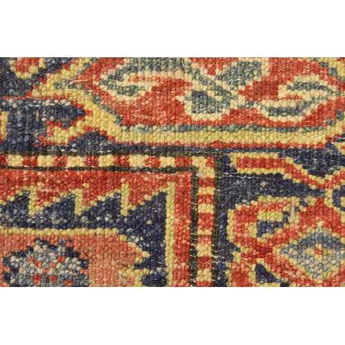 8 - Modern Turkish rug of Caucasian design with a triple medallion on a brick red ground with borders, 1... 