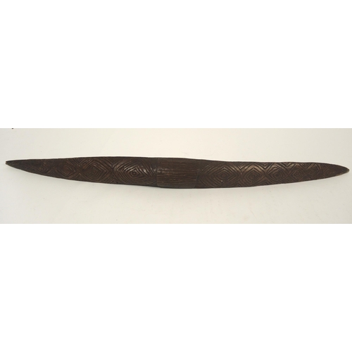 80 - Late 19th / early 20th Century Aborginal parrying shield with typical carved decoration, 82.5cm long