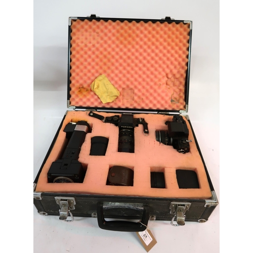 85 - Two Topcon 35mm cameras with various lenses and other accessories in a fitted case and box, together... 