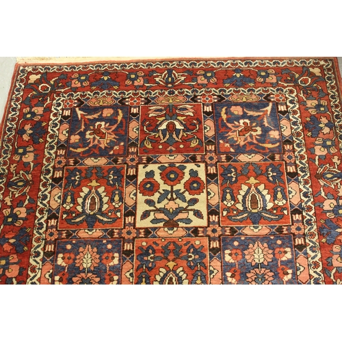 9 - Bakhtiari rug with a garden panel design in shades of red, blue and cream with borders, 202 x 135cm