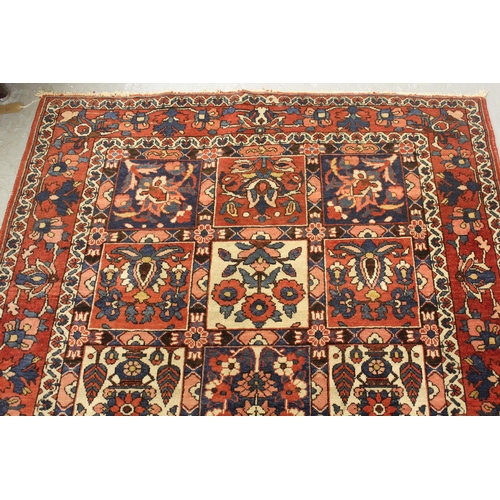 9 - Bakhtiari rug with a garden panel design in shades of red, blue and cream with borders, 202 x 135cm