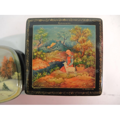 94 - Group of three small 20th Century Russian papier mache boxes, the lids painted with various landscap... 