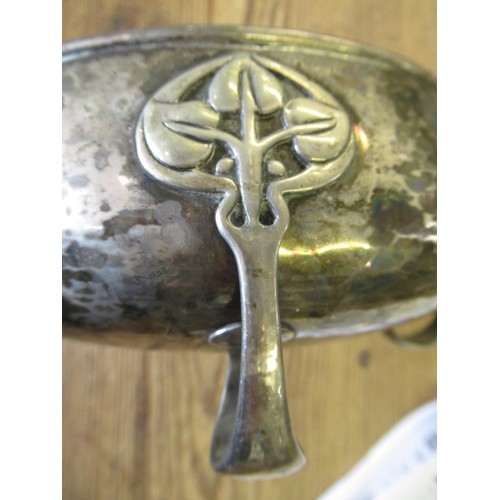 644 - Birmingham silver fruit bowl of Art Nouveau design, the beaten body raised on four stylised supports... 