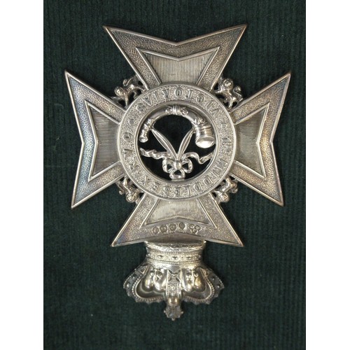 81 - Middlesex Rifle Volunteer Corps Victorian silver badge, hallmarked Birmingham 1888, together with tw... 