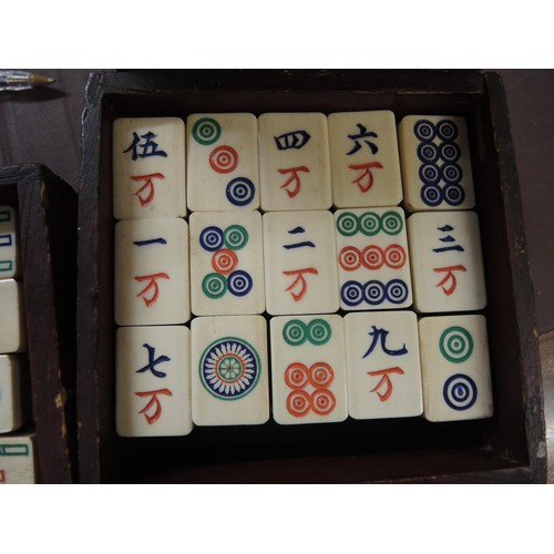 137 - Late 19th / early 20th Century bone and bamboo mahjong set in a brass mounted four drawer case, toge... 