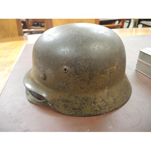 124 - World War II German M35 steel helmet with leather liner