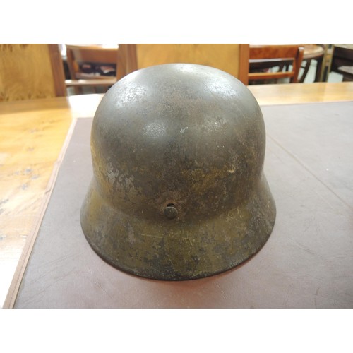 124 - World War II German M35 steel helmet with leather liner