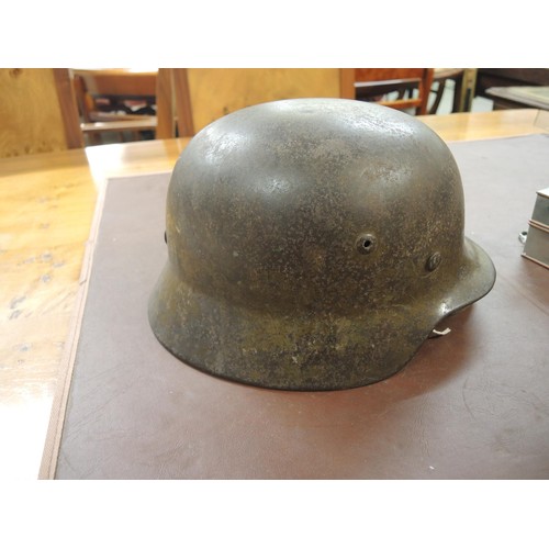 124 - World War II German M35 steel helmet with leather liner