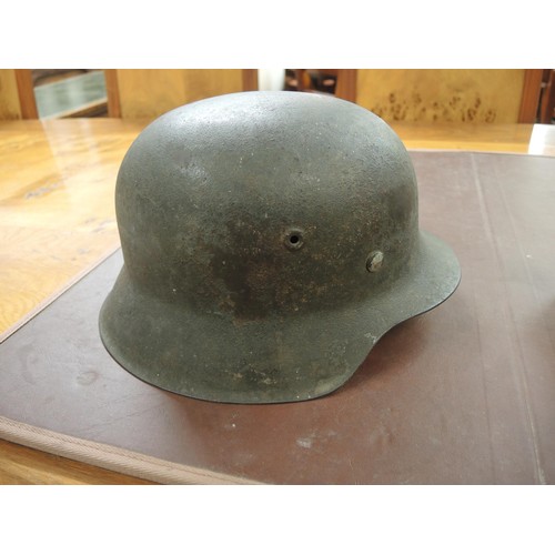 126 - World War II German M42 steel helmet, numbered 12230