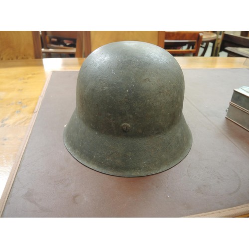 126 - World War II German M42 steel helmet, numbered 12230