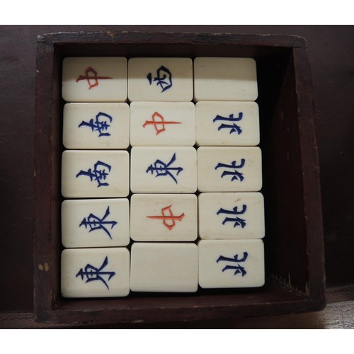 137 - Late 19th / early 20th Century bone and bamboo mahjong set in a brass mounted four drawer case, toge... 