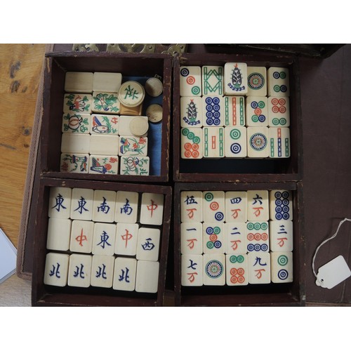 137 - Late 19th / early 20th Century bone and bamboo mahjong set in a brass mounted four drawer case, toge... 