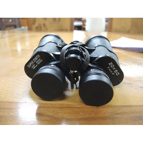 235 - Three various cased pairs of binoculars