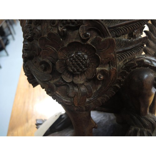 239 - Indian carved hardwood figure of a Rangda, 46cm high