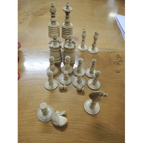 272 - 19th Century turned red stained and natural bone chess set, the Kings 12.5cm high