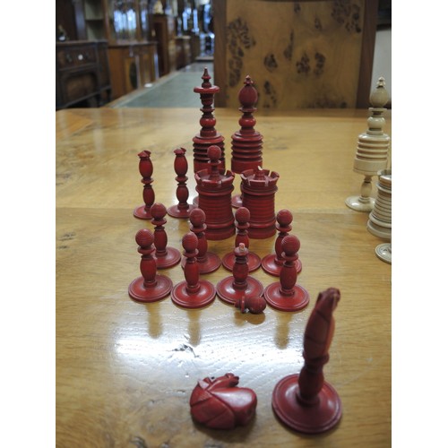 272 - 19th Century turned red stained and natural bone chess set, the Kings 12.5cm high