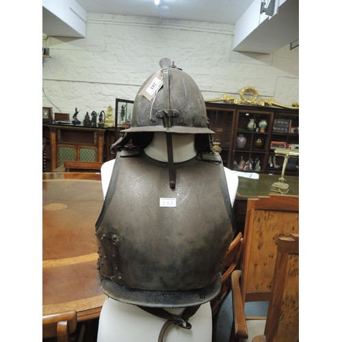 283 - 17th Century type lobster tail steel helmet, together with a similar steel breast plate