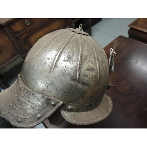 283 - 17th Century type lobster tail steel helmet, together with a similar steel breast plate