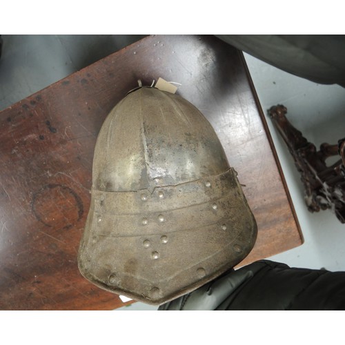 283 - 17th Century type lobster tail steel helmet, together with a similar steel breast plate