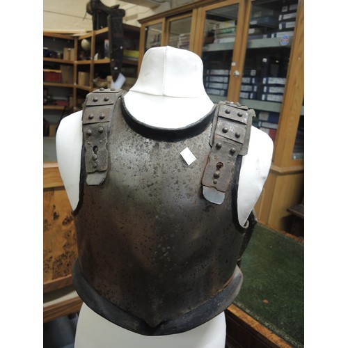 283 - 17th Century type lobster tail steel helmet, together with a similar steel breast plate