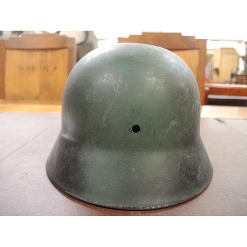 130 - Three various German M40 pattern steel helmets