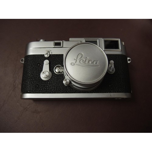 267 - Leica M3 camera outfit, serial number 984346 with original leather case, together with three lenses,... 