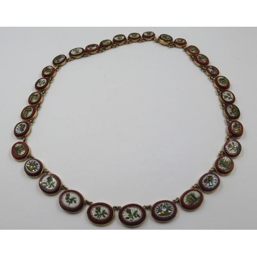 19th Century Italian gold mounted micro mosaic necklace, set with thirty two graduated oval panels depicting antiquities, birds and flowers, 40cm in length, the largest panel 13mm x 11mm, gross weight 26g