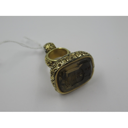 1087 - Large floral cast gold fob with intaglio inset seal, gross weight 31g