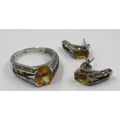 1107 - 9ct White gold citrine set ring, size P, 4g, together with a pair of matching earrings