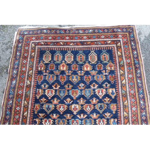 12 - Small Shirvan rug with an all-over Boteh design on a blue ground with borders, 144 x 109cm approxima... 